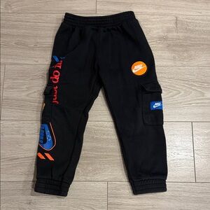Nike Kids Black Joggers with Orange and Blue Accents
